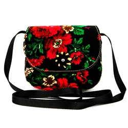 An attractive shoulder purse made of leather and fabric. 24" long shoulder strap. Purse size is approx 6" x 5.5" x 3". Made In Poland.