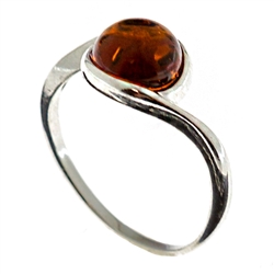 Petite size round honey amber set in sterling silver.