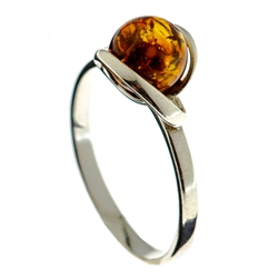 Petite size honey round amber set in sterling silver.