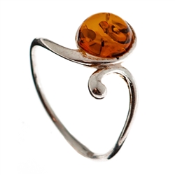 Petite size honey round amber set in sterling silver.
