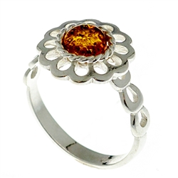 Petite size round honey amber set in sterling silver.