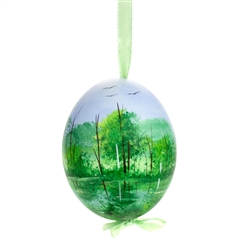 This beautiful hand painted duck egg comes ready to hang. The eggs have been emptied and strung through with ribbon for hanging. No two eggs are exactly alike and ribbon colors vary as well.