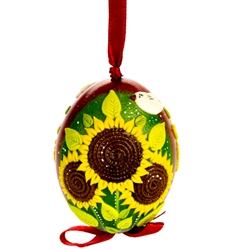 This beautifully designed chicken egg is hand painted and decorated. The figures are made from dried salt that is applied to the egg, formed, dried and finally painted. A  little work of art!