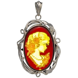 Beautiful oval shaped sterling silver amber cameo pendant. The cameo is hand carved from the back of the pendant. Nicely detailed. Size is approx 1.75" x 1.2".