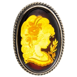 Beautiful oval shaped sterling silver amber cameo pendant/brooch. Can be worn either as a pendant using the silver loop or as a brooch using the pin. The cameo is hand carved from the back of the pendant. Nicely detailed. Size is approx 1.6" x 1.2".