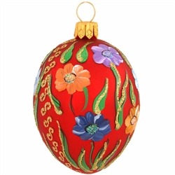 Masterfully crafted of glass from Poland, this truly egg-straordinary ornament is artfully hand-painted with a myriad of vibrant glazes and glistening glitter accents. Measuring 2" tall, our red egg with floral pattern is sure to be an eggs-quisite addit