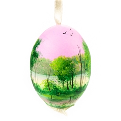 This beautiful hand painted duck egg comes ready to hang. The eggs have been emptied and strung through with ribbon for hanging. No two eggs are exactly alike and ribbon colors vary as well.