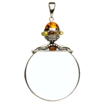 Unique and beautifully hand-crafted sterling silver magnifying glass decorated with amber highlights. Has its own silver finding which can be used to attach a chain if desired. Size is approx 3.25" x 2".