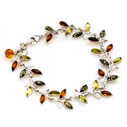 Three colors of amber set in silver shaped to form a trail of leaves in this lovely bracelet 7.5" - 19cm long.