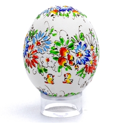 This beautifully designed chicken egg is hand painted by master folk artist Alina Wypchlo from Opole, Poland. Her colors are strong and bright. Look carefully and you will find humorous folk elements of nature incorporated into her designs (i.e. a cricket