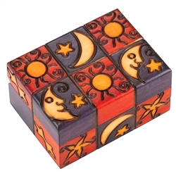 This box is decorated with carved and painted images of the moon, sun and stars on the top and side.  This beautiful box is made of seasoned Linden wood, from the Tatra Mountain region of Poland.