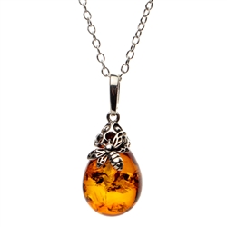 Sterling silver honey bee above a beautiful honey amber cabochon drop. Pendant size is approx. 1.5" x .5".