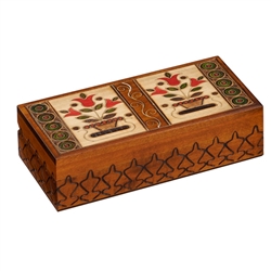A double floral pot design with red flowers decorates the lid of this wooden box. Additional carved details adorn the sides of the box.