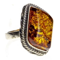 Honey colored amber and sterling silver  ring. Size approx. 1" x .75".