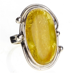 A beautiful oval amber cabochon set in sterling silver. Size approx 1.25" x .75"