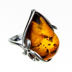 Tear drop shaped amber cabochon set in sterling silver.  Amber size is approx. .75" x .5"