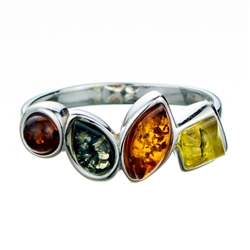 Artist sterling silver ring featuring 4 shades of amber.  Size is approx 1" x .25".