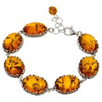 7 elegant oval amber cabochons each set with sparkling sterling. 7.5" long and adjustable smaller.