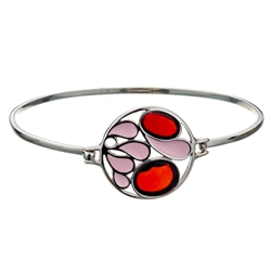 This sterling silver bracelet features 2 cherry amber discs. Size is 7" diameter