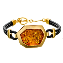 This sterling silver bracelet features a honey color amber cabochon.. Bracelet size is 7.5" diameter. Cabochon size is approx 1" x .75"