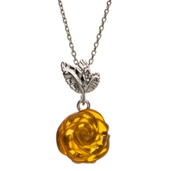 Beautifully carved amber rose set in sterling silver.  Pendant size is approx 1' x.5"