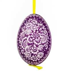 This beautifully designed goose egg is dyed one color and the design scratched into the egg using a sharp knife. The technique is called "skrobanki" in Polish. The eggs have been emptied and strung through with ribbon for hanging. No two eggs are exactly