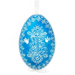 This beautifully designed egg is dyed one color, then white wax is melted and applied to form an intricate design which is left on the surfce. The egg is emptied and strung with ribbon for hanging.