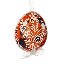 This beautifully designed quail egg is dyed one color, then white wax is melted and applied to form an intricate design which is left on the surface. Please note that quail eggs shells are naturally speckled brown and black and the black surfaces remain