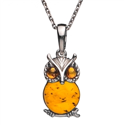 Sterling silver and honey amber owl. Pendant size is approx. .75" h x .5" w.