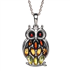 Sterling silver owl studded with multi-color amber. Pendant size is approx. 1" h x .6" w.