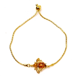 This adjustable gold plated bracelet features a gold plated and amber honey bee. Bracelet can be adjusted to a maximum 8.5" diameter.