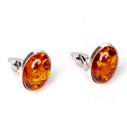 Beautiful pair of oval shaped amber and silver earrings. Size is approx .5" x .4".