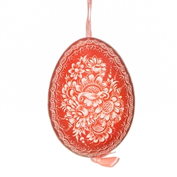 This beautifully designed chicken egg is dyed one color and the design scratched into the egg using a sharp knife. The technique is called "skrobanki" in Polish. The eggs have been emptied and strung through with ribbon for hanging. No two eggs are exactl