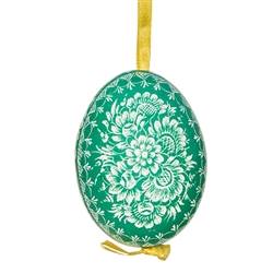 This beautifully designed chicken egg is dyed one color and the design scratched into the egg using a sharp knife. The technique is called "skrobanki" in Polish. The eggs have been emptied and strung through with ribbon for hanging. No two eggs are exactl