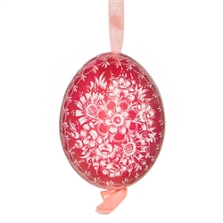 This beautifully designed chicken egg is dyed one color and the design scratched into the egg using a sharp knife. The technique is called "skrobanki" in Polish. The eggs have been emptied and strung through with ribbon for hanging. No two eggs are exactl