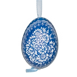 This beautifully designed chicken egg is dyed one color and the design scratched into the egg using a sharp knife. The technique is called "skrobanki" in Polish. The eggs have been emptied and strung through with ribbon for hanging. No two eggs are exactl