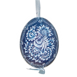 This beautifully designed chicken egg is dyed one color and the design scratched into the egg using a sharp knife. The technique is called "skrobanki" in Polish. The eggs have been emptied and strung through with ribbon for hanging. No two eggs are exactl