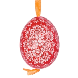 This beautifully designed chicken egg is dyed one color and the design scratched into the egg using a sharp knife. The technique is called "skrobanki" in Polish. The eggs have been emptied and strung through with ribbon for hanging. No two eggs are exactl