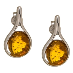 Baltic Amber earrings framed with a ring of sterling silver. Size is approx .75" long x .4" wide.