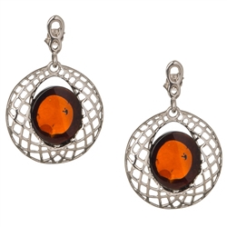 Gorgeous Baltic Amber earrings surrounded with a ring of Sterling Silver filigree work. Approx 1.2" long x .5" wide.