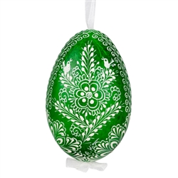 This beautifully designed egg is dyed one color, then white wax is melted and applied to form an intricate design which is left on the surfce. The egg is emptied and strung with ribbon for hanging.