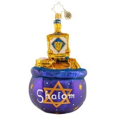 We see this little dreidel, it is made to spin and spinï¿½when it is tired of spinning, it stops and then we win! This beloved Hanukkah dreidel sits atop a purse of the coveted prize--loads of shiny gold coins.