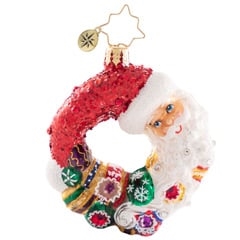 Give love, get love…no one knows this full circle of the season better than good old Saint Nick. This stunning miniature wreath includes Santa himself and some of the prized ornaments from his collection.