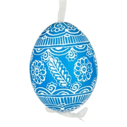 This beautifully designed egg is dyed one color, then white wax is melted and applied to form an intricate design which is left on the surfce. The egg is emptied and strung with ribbon for hanging.