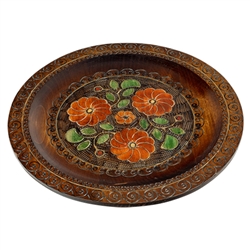 Hand Made in Nowy Sacz, Poland Polish wooden plates are made from Linden wood in the mountain region of southern Poland called Podhale. The plates are cut and shaped on a lathe by hand. The floral designs are burned into the wood then painted after staini