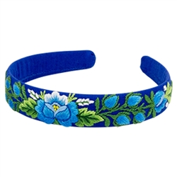 This is a flexible headband that has been covered in blue material that has been hand embroidered in a Lowicz style floral pattern. Made in Lowicz, Poland. No two are alike. Picture shows for examples. Price is for one headband.