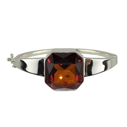 This sterling silver bracelet features a gorgeous cognac color amber cabochon.. Bracelet size is 6.75" diameter. Cabochon size is approx .75" square.