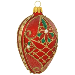 Incredibly detailed, this beautiful red matte egg features gold glitter lattice designs as well as festive poinsettias blossoming with red and green glitter. Masterfully crafted of glass in Poland, 3" tall ornament will add an "egg"-xtraordiary brillianc