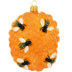 The honeycomb is home-sweet-home for this busy colony of honeybees! A symbol of industry, resourcefulness and prosperity, bees demonstrate the success and satisfaction found in working together toward a common goal. Shimmering with glazes of black and gol