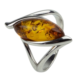 A marquise shaped honey amber cabochon set in an artistic swirl of sterling silver.  Amber size is approx. 0.6" x 0.4"